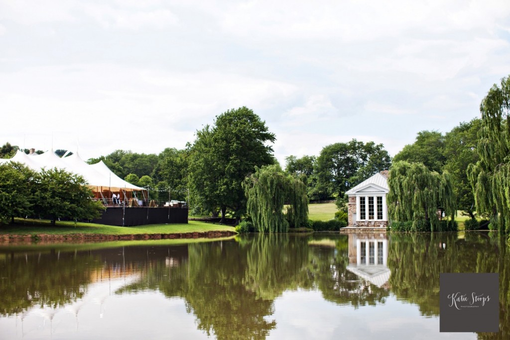 a sperry tent with a leveled floor overlooks a pond at a family estate in Virginia