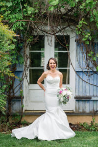 Laughing bride standing outside - Bellwether Events