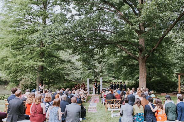 McLean Virginia backyard wedding ceremony - a mix of benches and chairs 