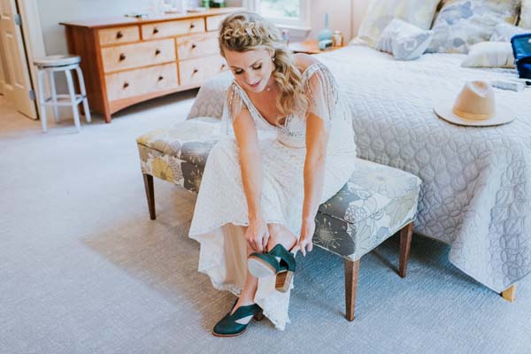 McLean Virginia wedding at home - bride puts on her green shoes