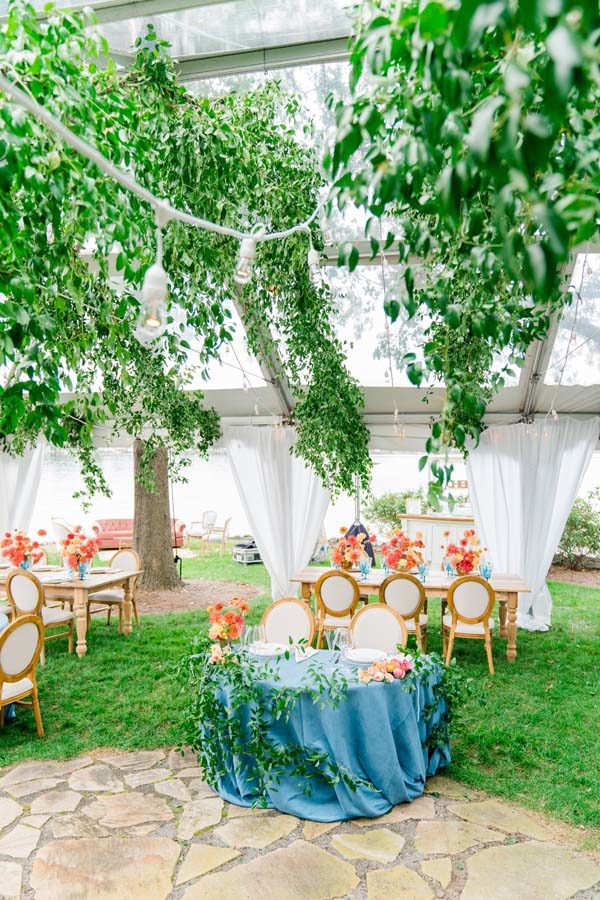 Maryland waterfront wedding secret garden tent blue orange greenery ceiling