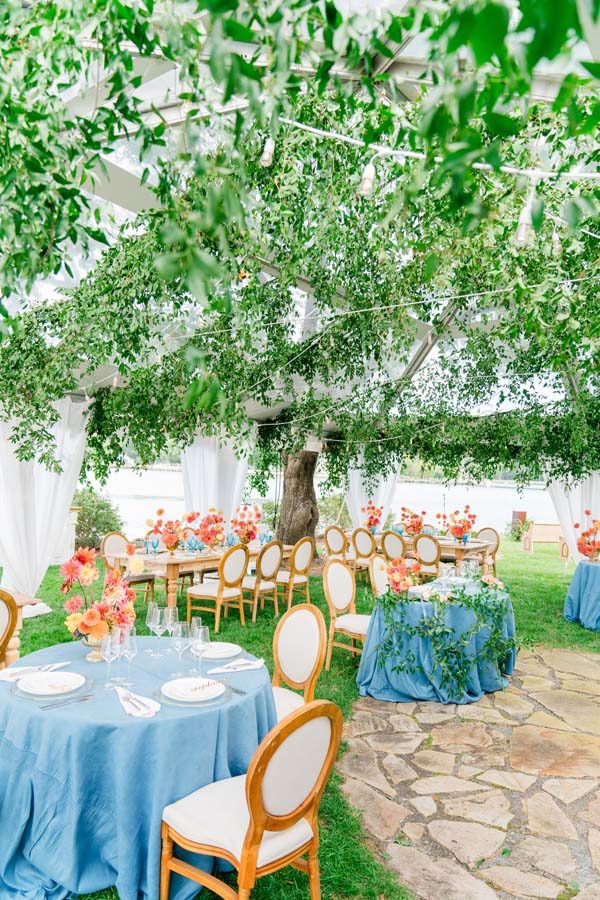 Maryland waterfront wedding secret garden tent blue orange greenery ceiling