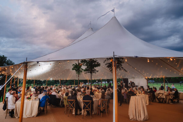 Sperry wedding tent filled with guests at Virginia family farm 