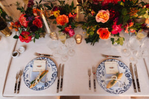 Garden inspired dinner place settings at a private residence wedding reception planned by Janice Carnevale of Bellwether Events