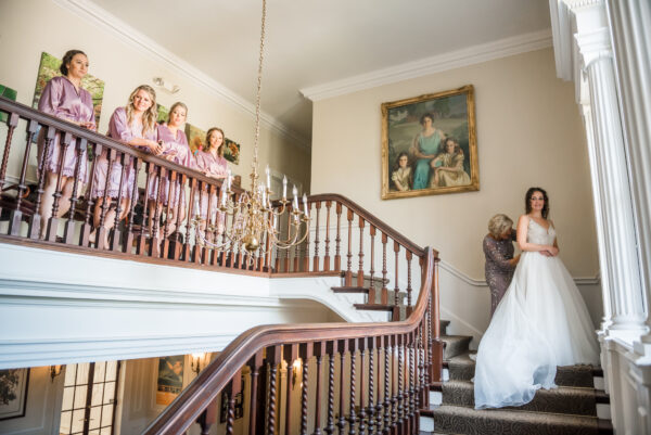 Bride and bridesmaids on the wedding morning at private estate Woodend Mansion